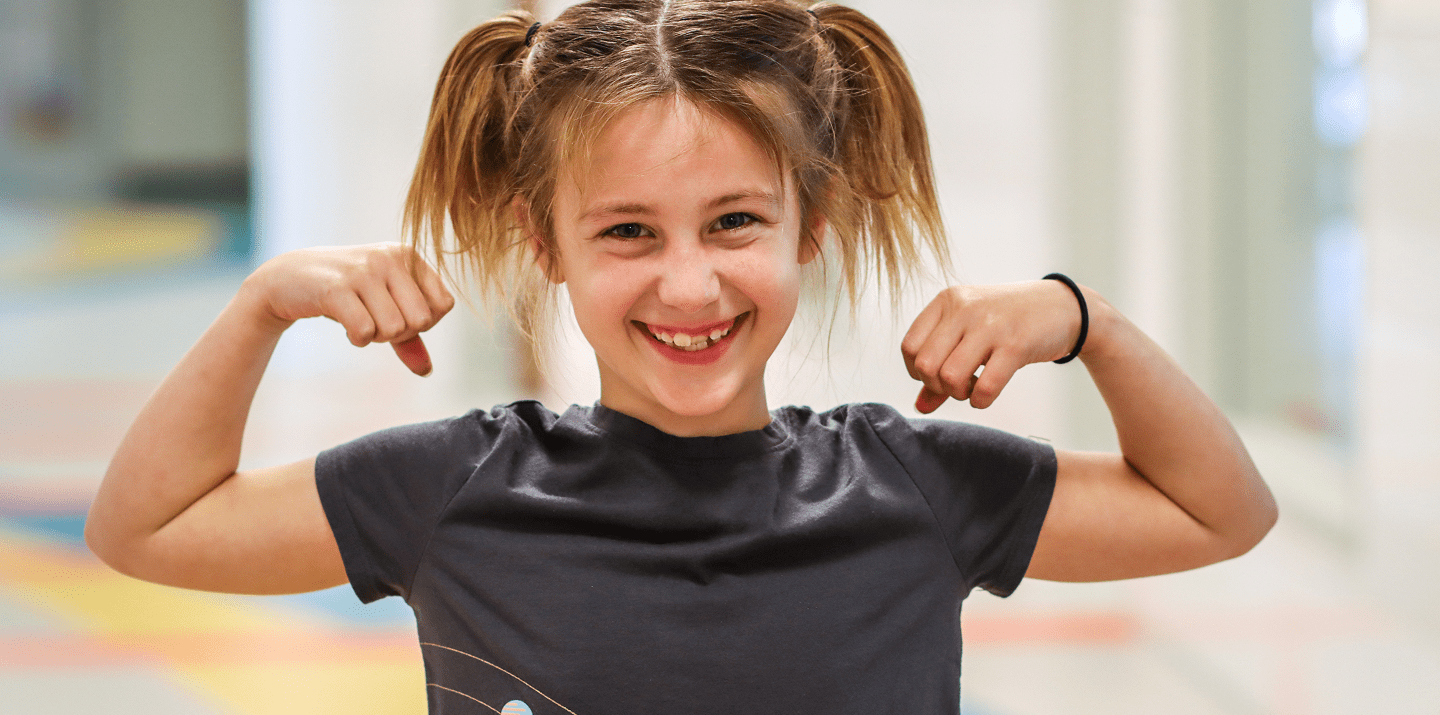 Young girl flexing